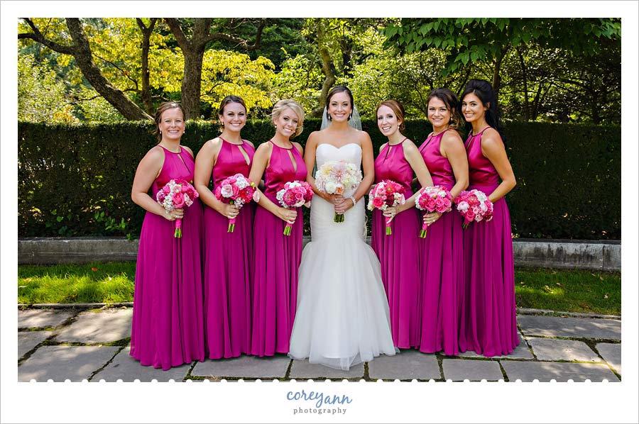 Bride and bridesmaids with long pink gowns