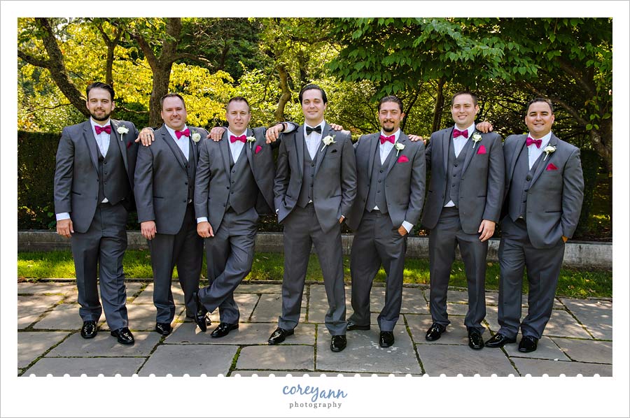 Groom and Groomsman wedding portrait in grey three piece suits