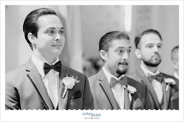 Groom seeing bride for the first time at wedding ceremony