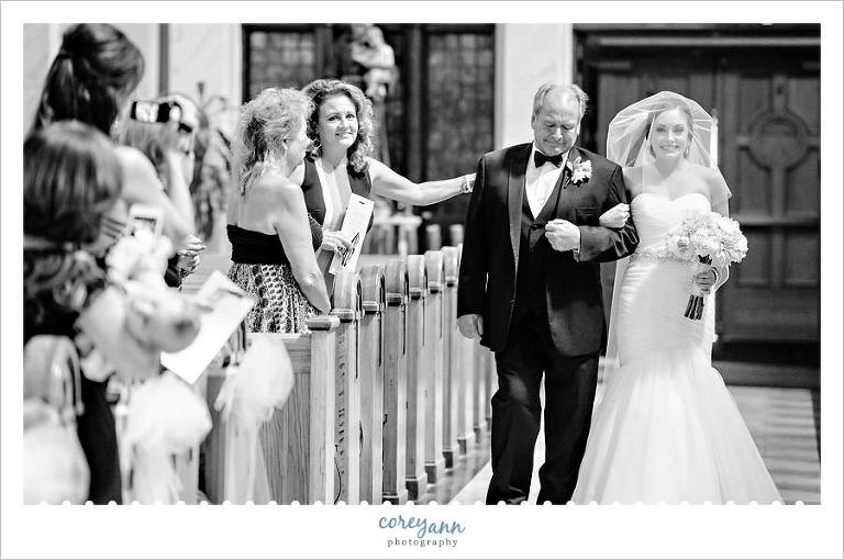 Bride being escorted down the aisle by her father in Tremont Ohio