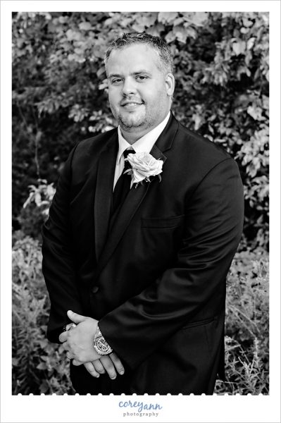 black and white portrait of groom 