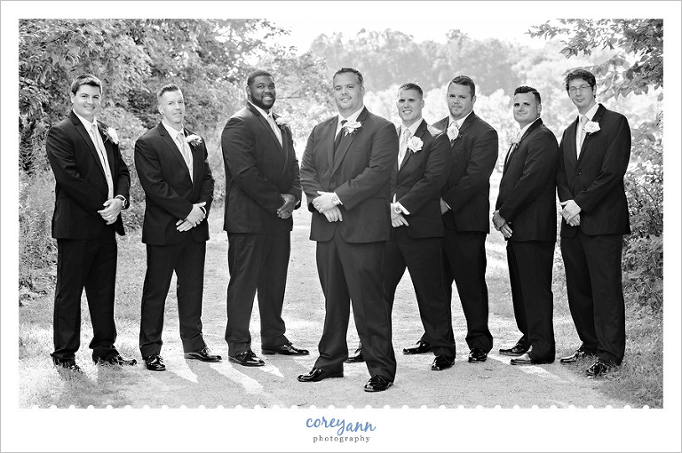 black and white photo of groom and groomsman