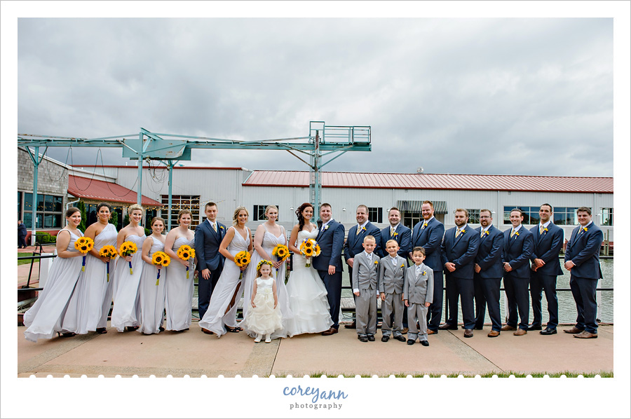 large bridal party outside of lyman harbor