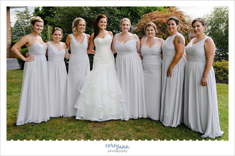 bridesmaids in different grey gowns 