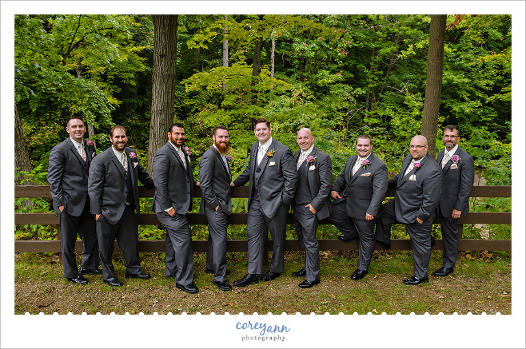 groom and groomsmen in dark grey suits