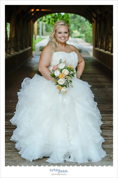 Bride posing at covered bridge in olmsted falls 