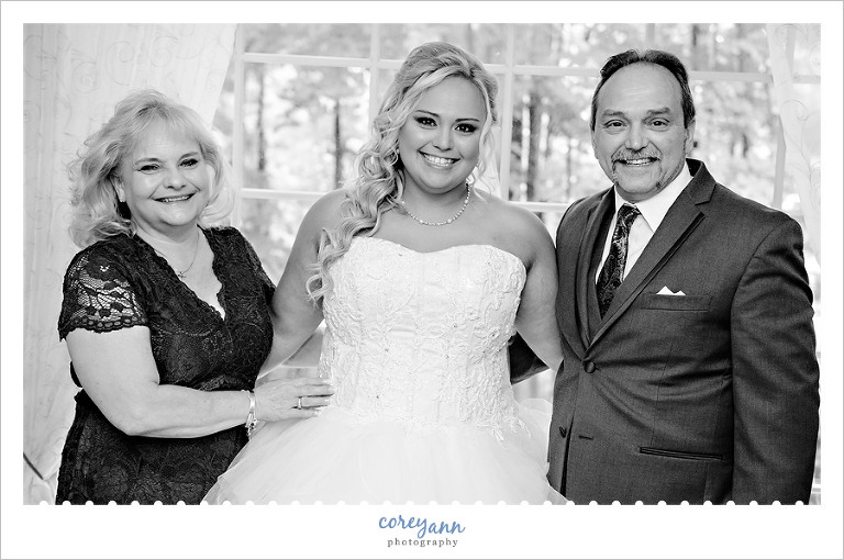 black and white portrait of bride with parents