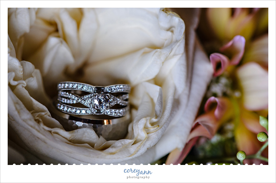wedding rings on rose in bride's bouquet