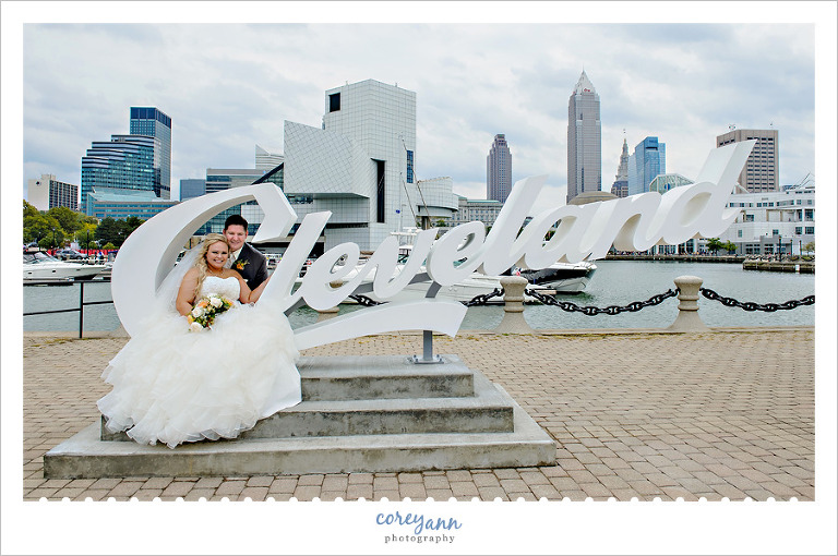 Bride and groom at the cleveland script sign in downtown