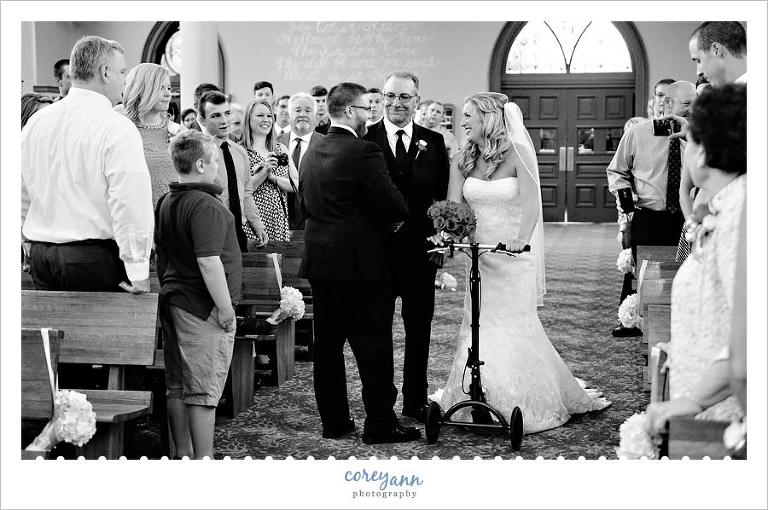 Father giving away the bride in St. Henry