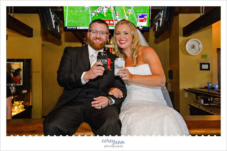 Bride and Groom sitting on bar in St. Henry Ohio