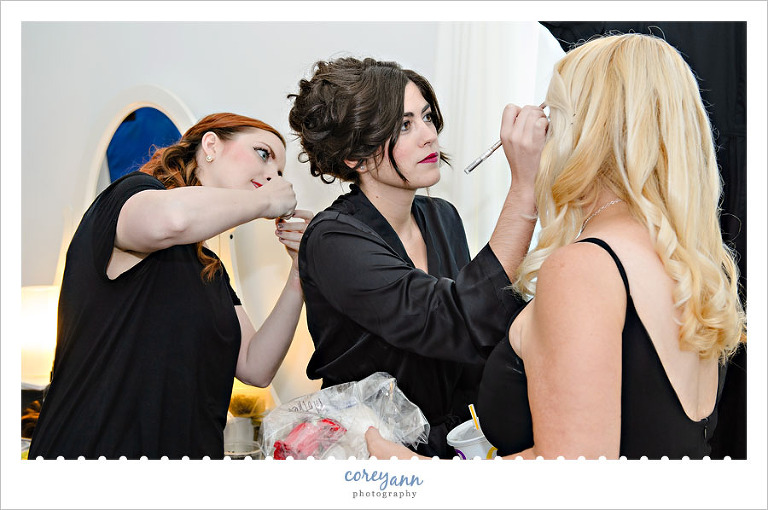 bride and maids doing makeup before the wedding in louisville