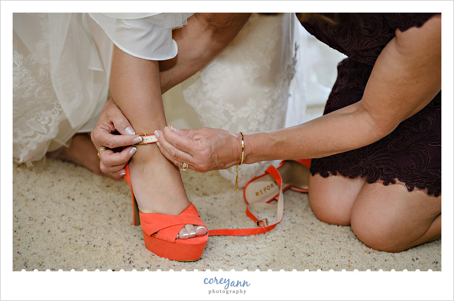 bride's mother buckling high heeled coral shoes