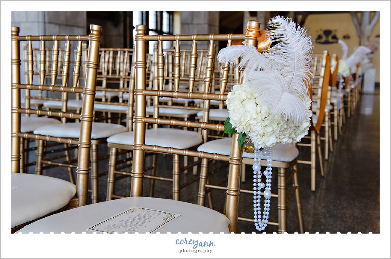 Ostrich feather and floral aisle decorations