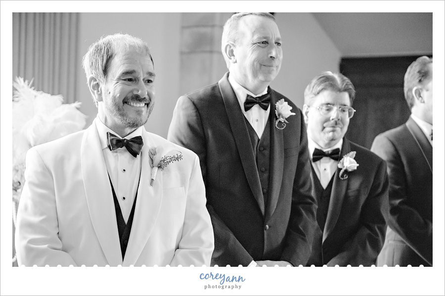 Groom seeing bride come down the aisle 