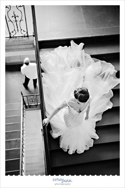 Bride walking down stairs to first look