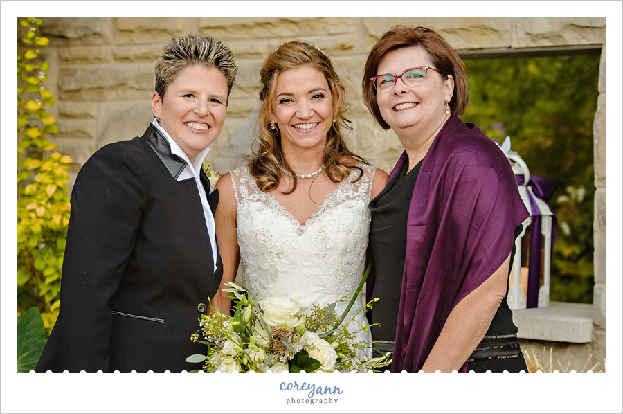 wedding couple posing with guests after ceremony