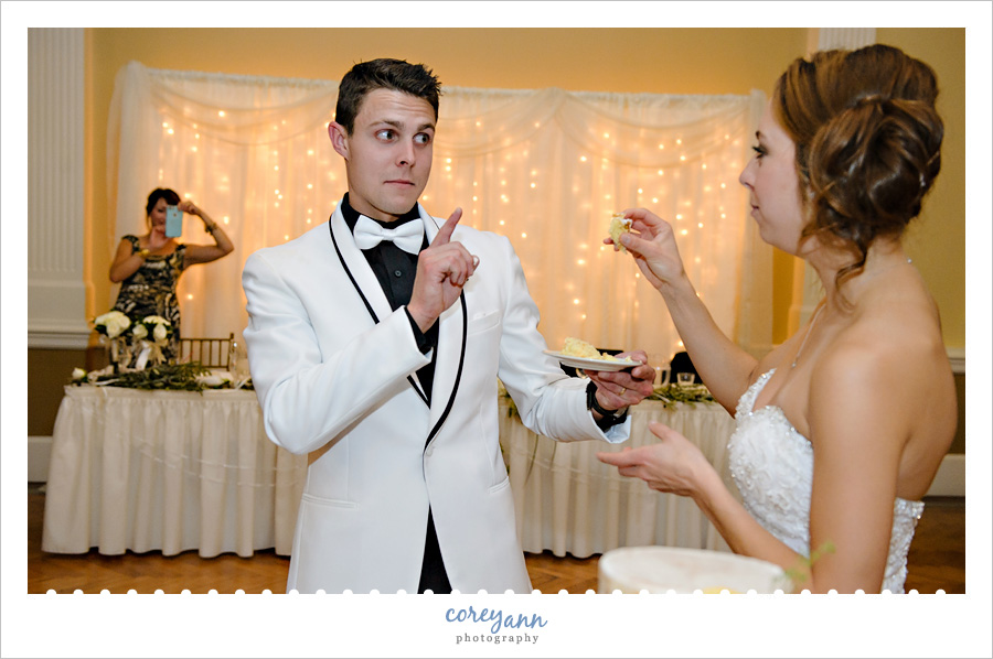 Cutting a naked wedding cake during wedding reception