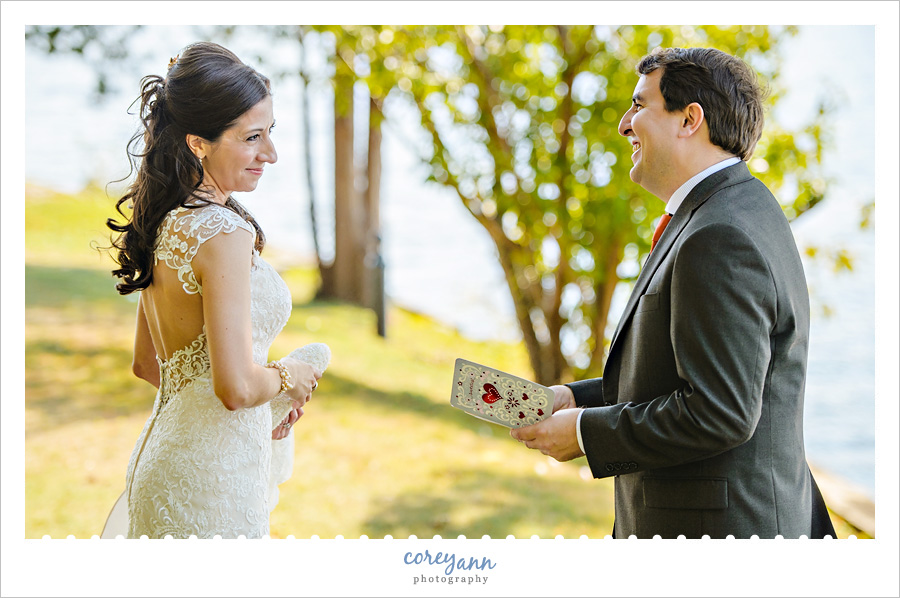 Groom reading card from Bride before wedding ceremony