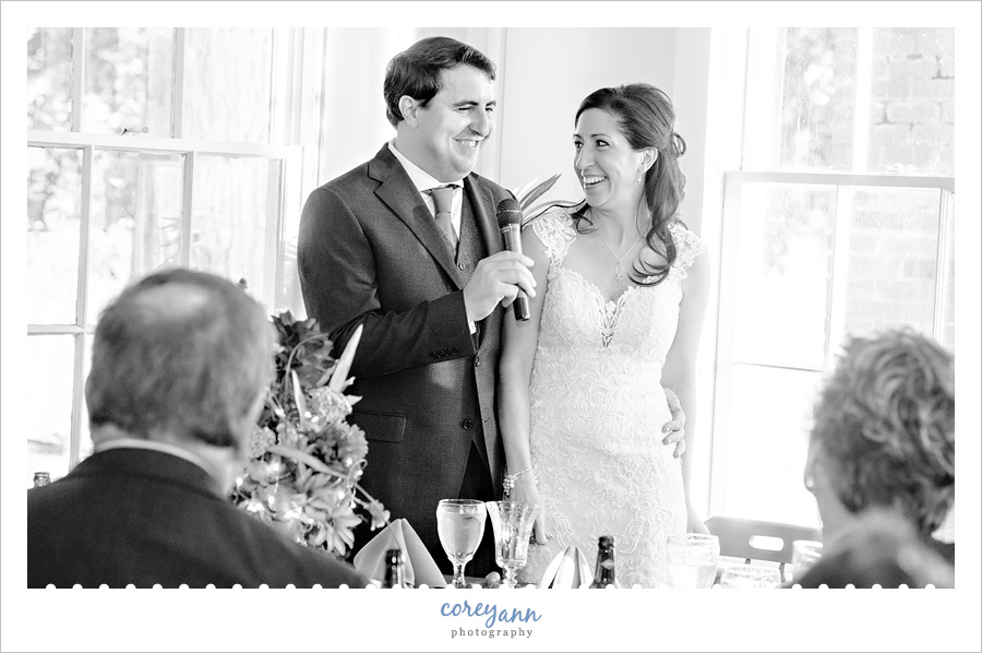 Bride and groom thanking guests at wedding reception