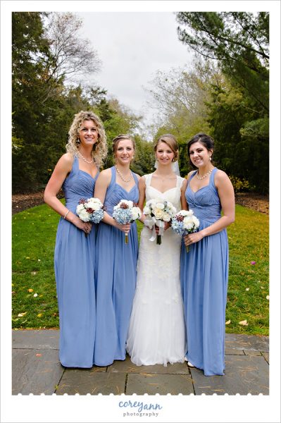 Bride and Bridesmaids in long blue gowns