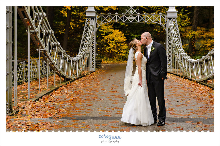Bride and Groom kissing on Cinderella Bridge in Youngstown 