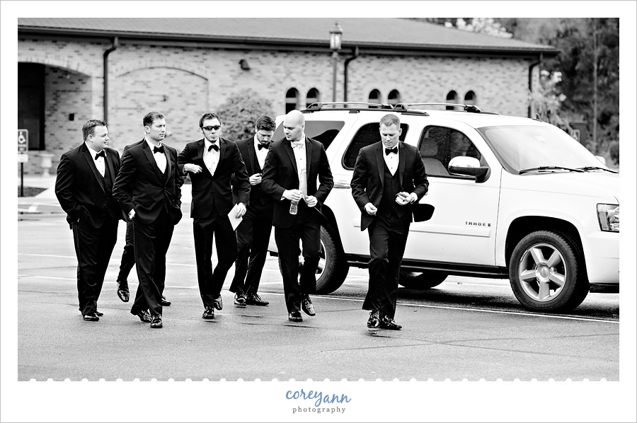 groom and groomsman walking into church in canfield ohio
