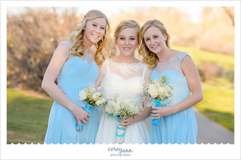 Bride and Bridesmaids in long blue gowns