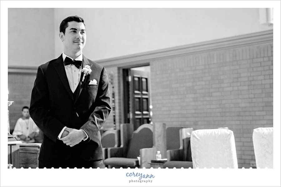 Groom seeing Bride walk down aisle