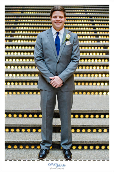 Groom in grey suit with blue tie in Cleveland