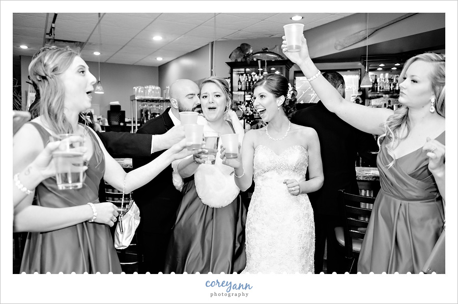 Bride and Groom celebrate wedding at bar