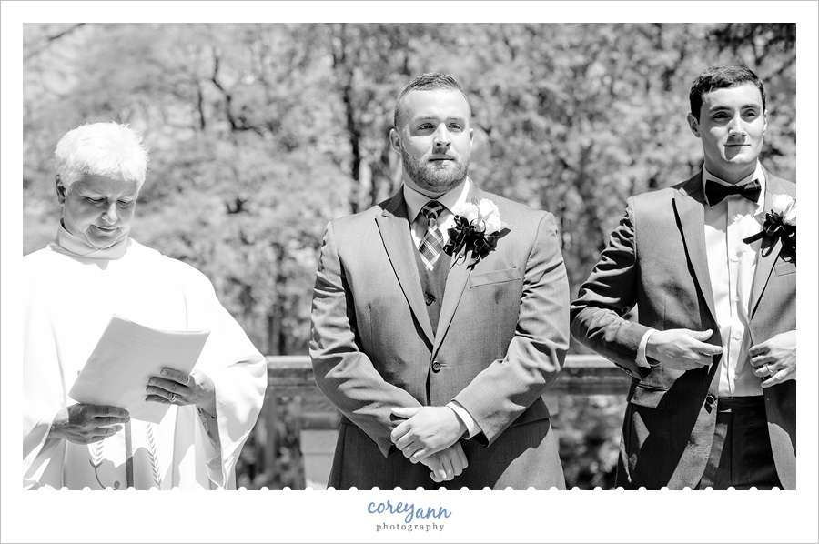Groom watching Bride walking down aisle at Stan Hywet
