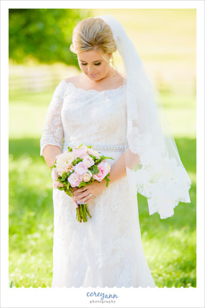 Bride in lace Oleg Cassini dress in Ohio