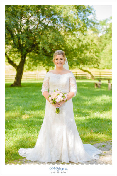 Bride in lace Oleg Cassini dress in Ohio