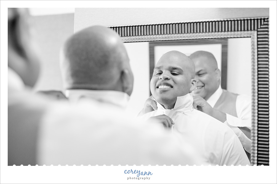 Groom getting ready before wedding in Ohio