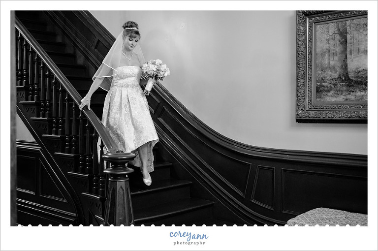 bride walking down stairs at steele mansion