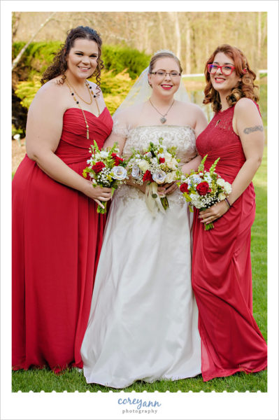 Bridesmaids in long red gowns