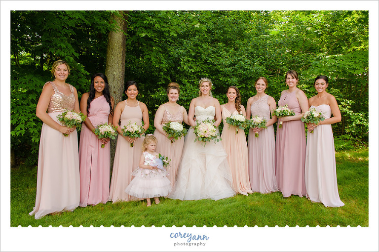 Bride and Bridesmaids in mismatched pink gowns