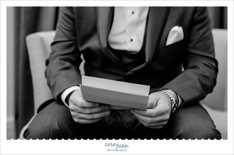 Groom reading letter from Bride before wedding in Cleveland