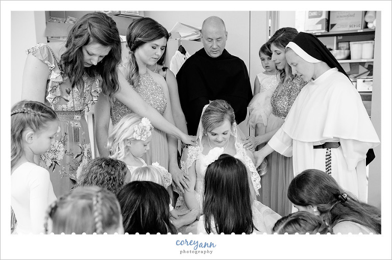 Praying Before Catholic Wedding in Malvern