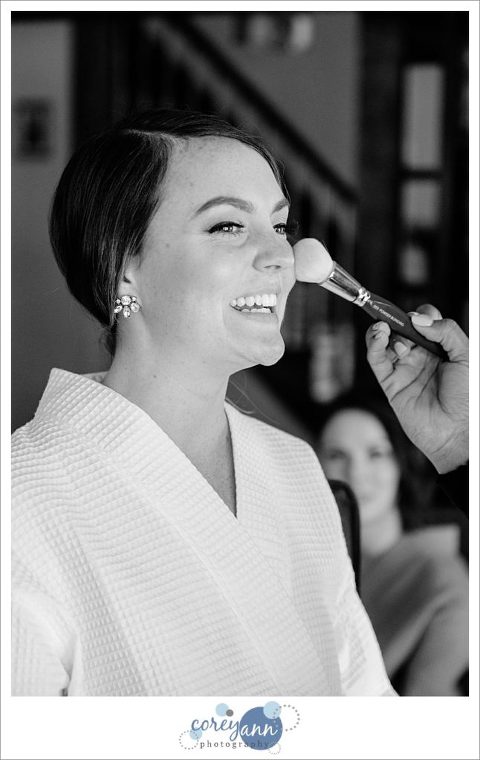 Bride getting makeup done by Cleveland Bridal Makeup