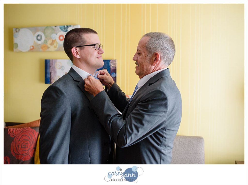 Groom getting ready for wedding in Akron