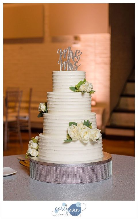 Classic white wedding cake by Tiffany's Bakery
