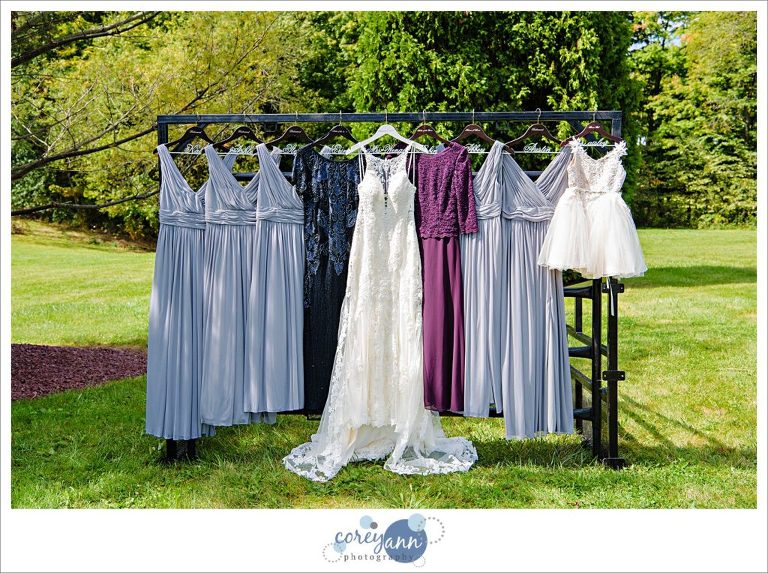 Bride and bridesmaid dresses hanging outside