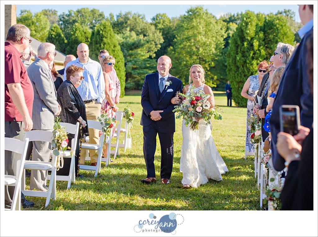 Bride walking down aisle at ohio wedding on farm