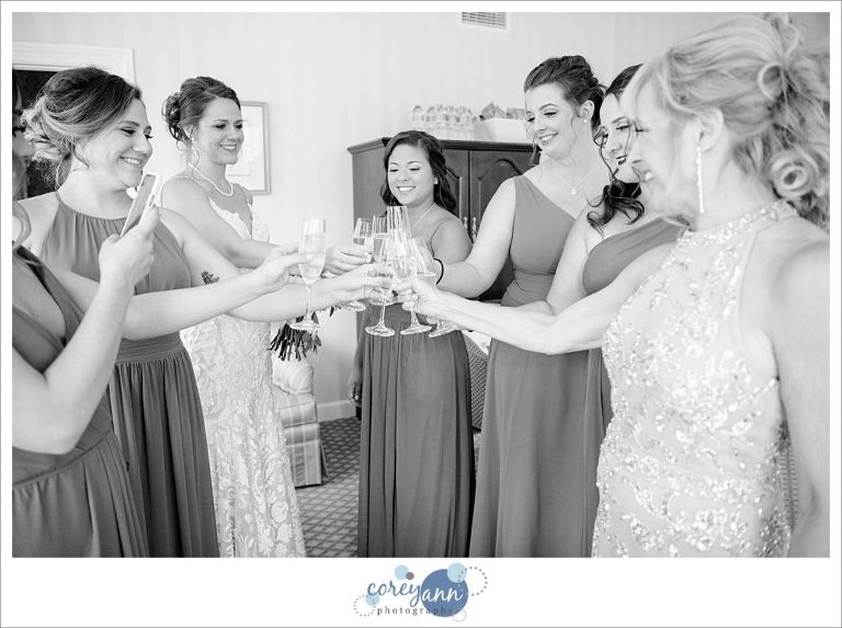 Bride and Bridesmaids toasting bride before wedding in Ohio