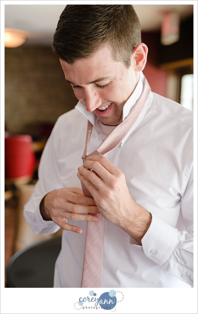 Groom getting ready for wedding at Blair Conference Center