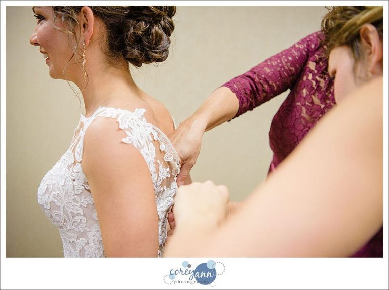 Bride getting dressed for wedding ceremony at Parkside Church