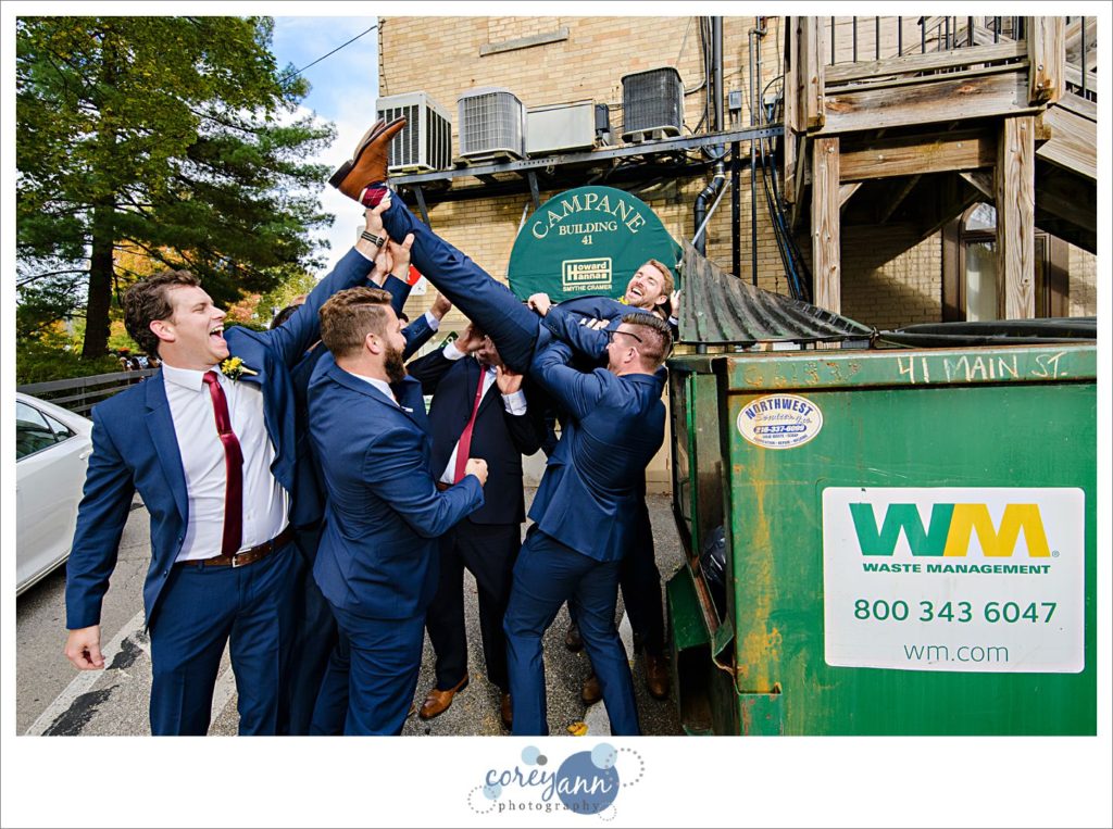 Groom and groomsman having fun