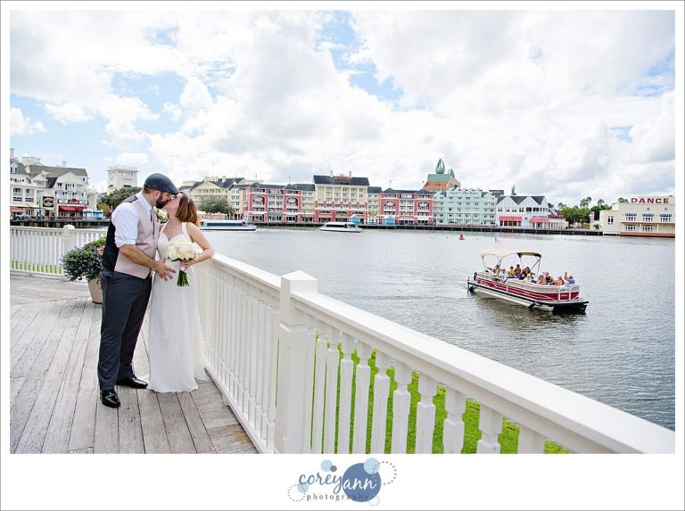 Bride and Groom kiss at Walk Disney World wedding on BoardWalk